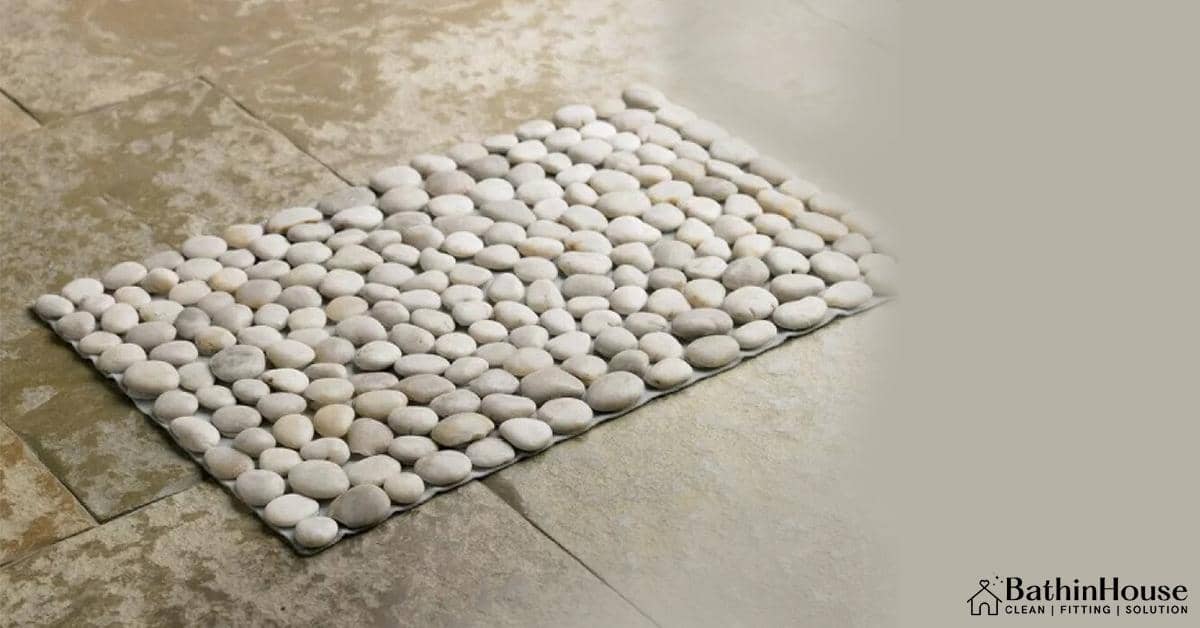 Stone bath mat in the floor
